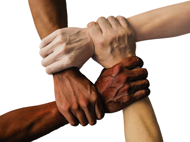 Group of diverse people laughing and enjoying a community event outdoors